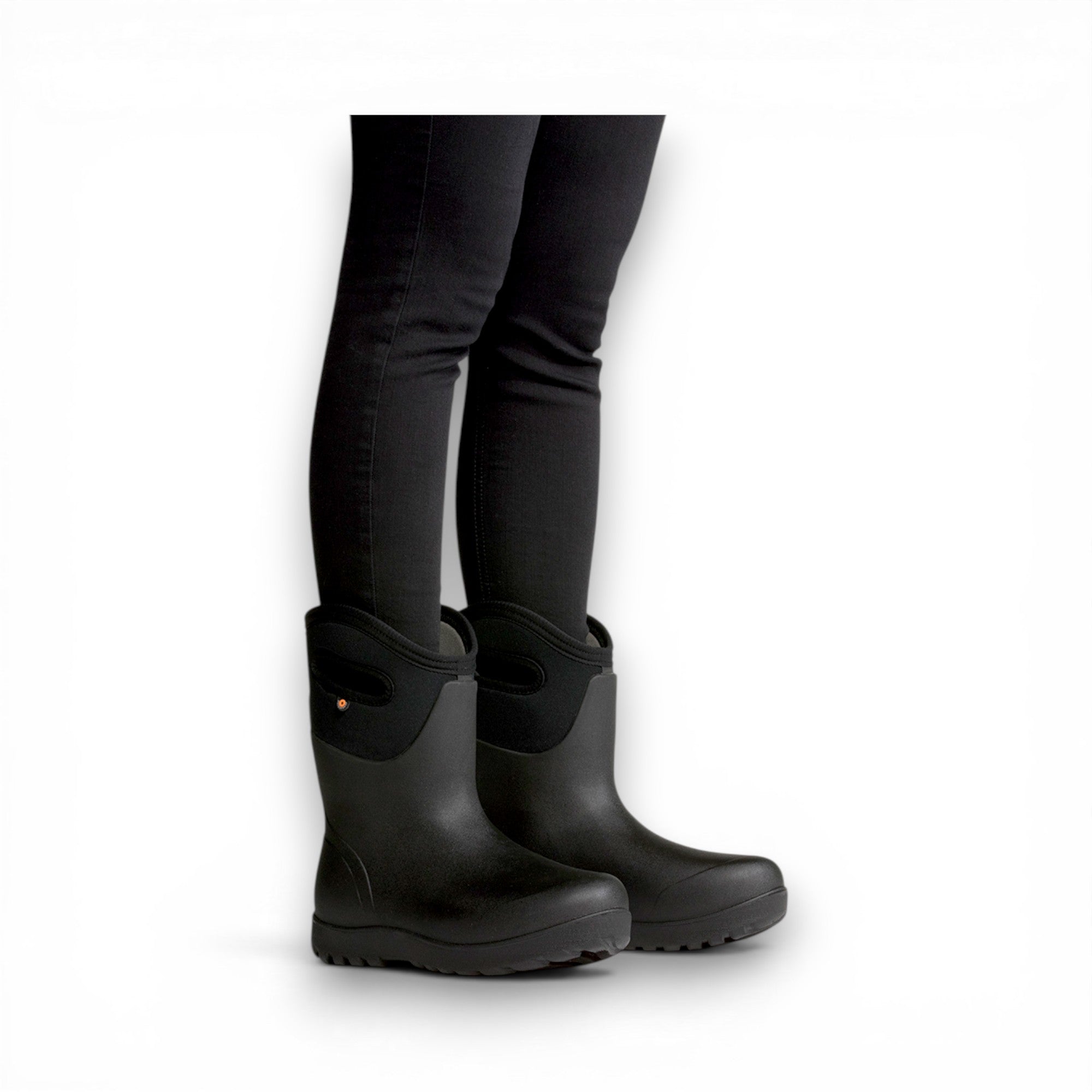 Black rubber boots worn with black leggings on a white background