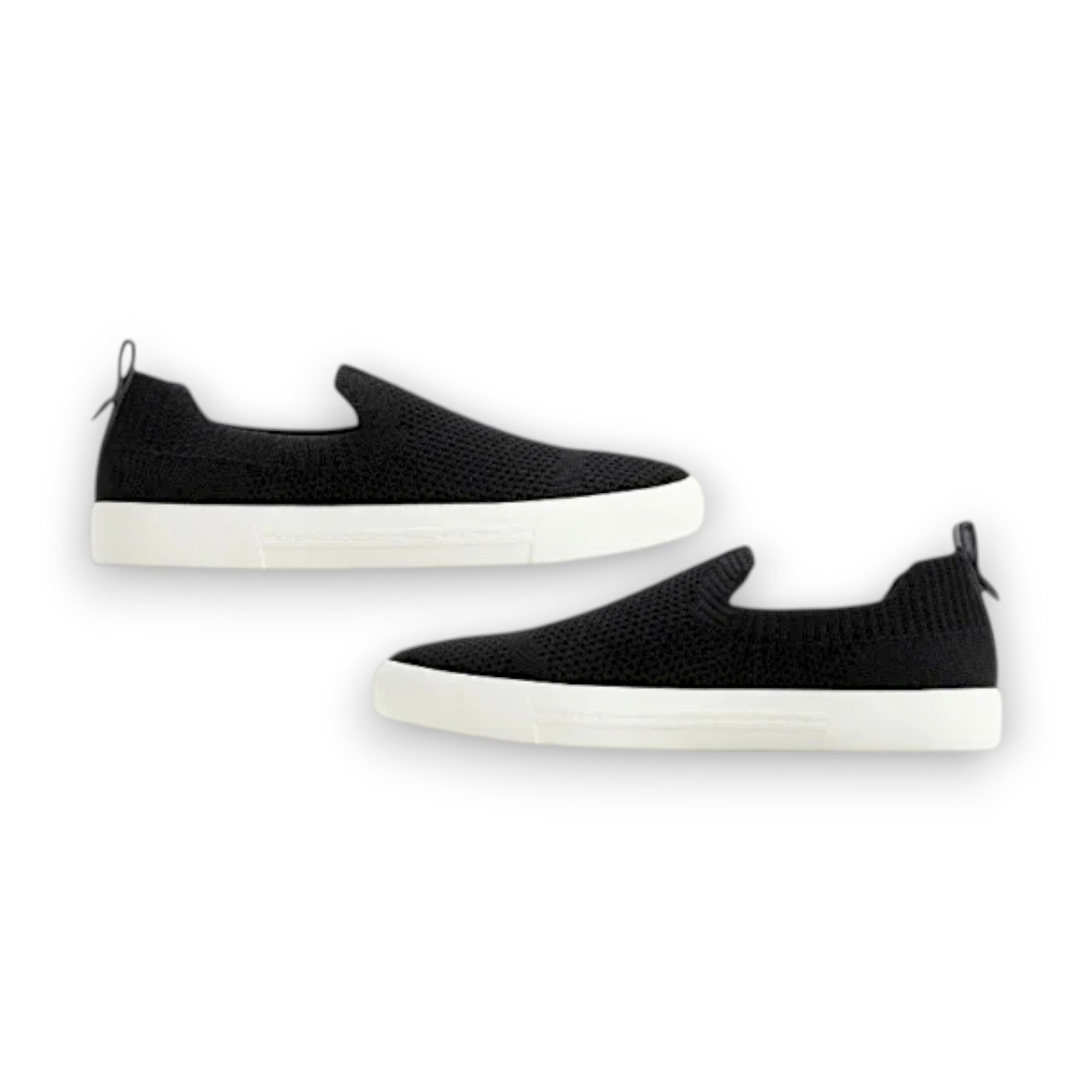 Black slip-on sneakers with white soles on a white background