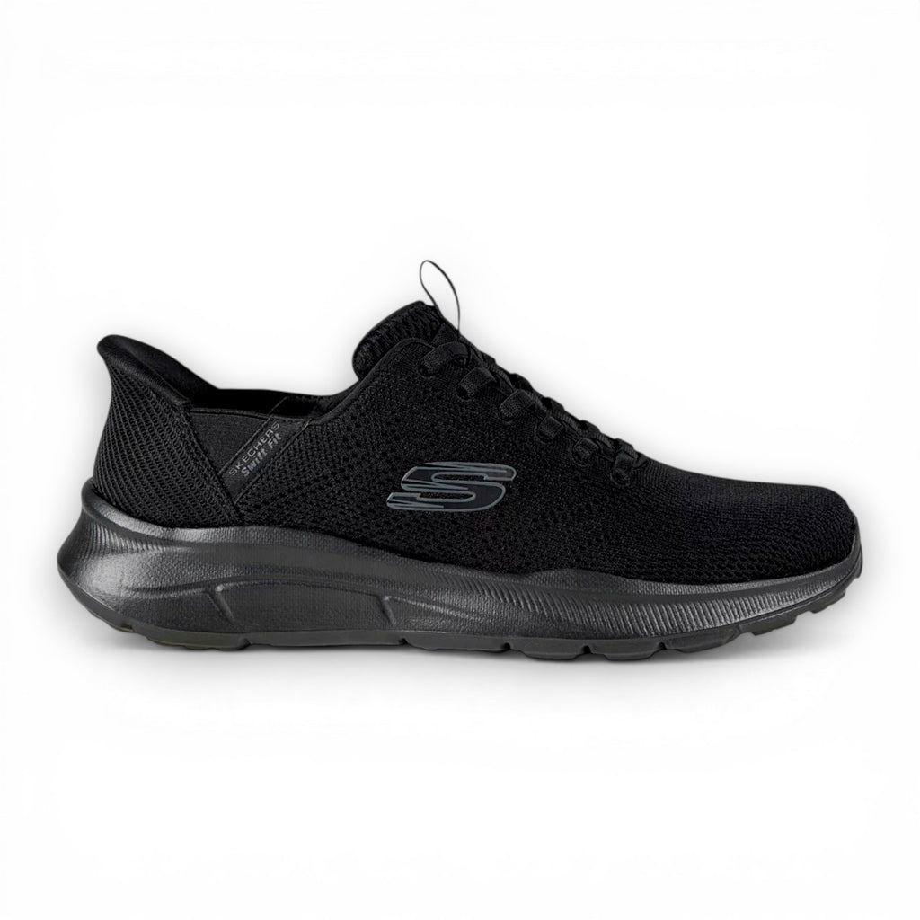 Black athletic shoe on a light gray background