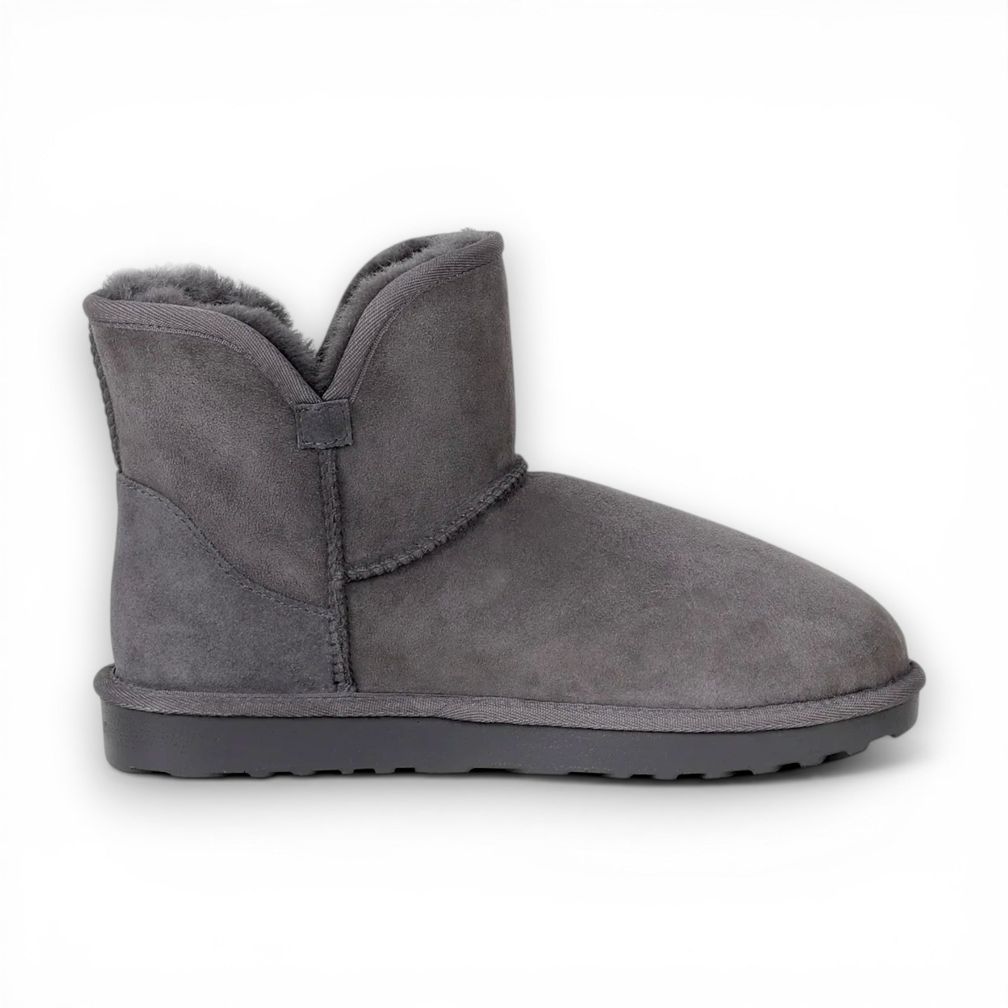 Gray suede boot with fur lining on a white background