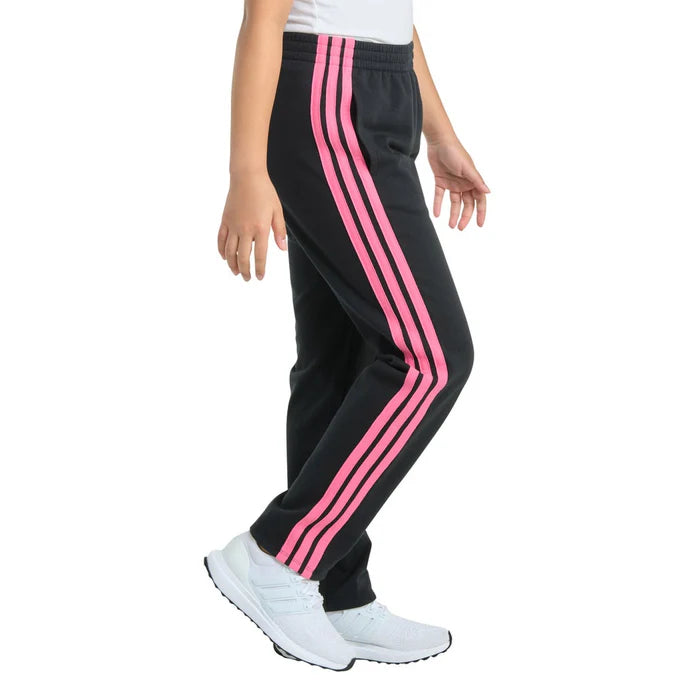 Black pants with pink stripes worn by a person on a white background