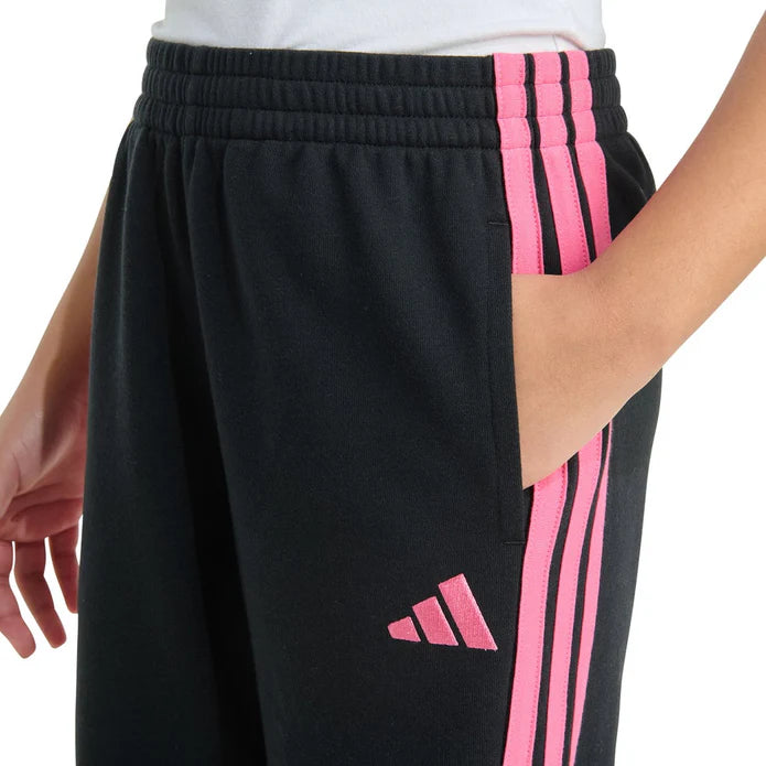 Black athletic shorts with pink stripes and logo on a white background