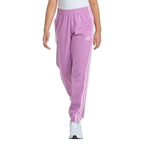 Purple Adidas sweatpants worn by a person on a white background