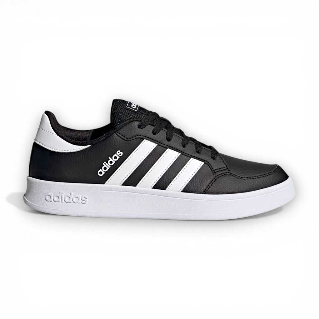 Black Adidas sneaker with white stripes on a white background
