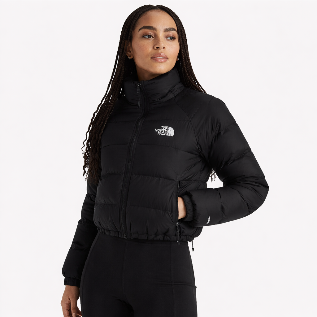 black puffer jacket with The North Face logo on a white background