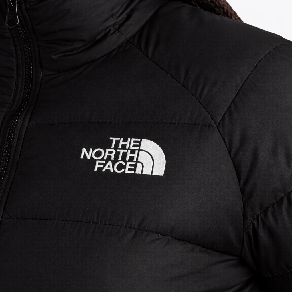 Black jacket with The North Face logo on a white background