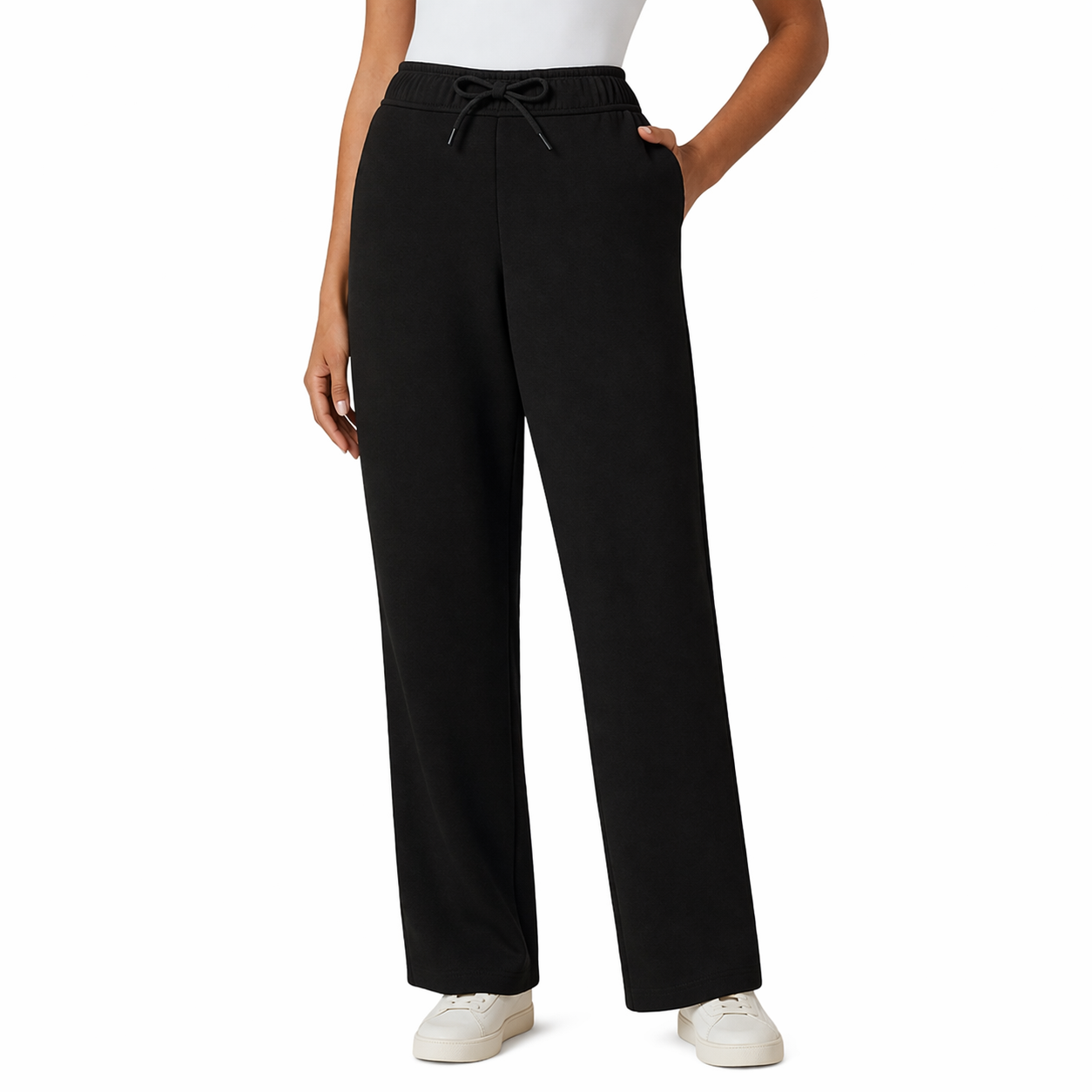 Black pants worn by a person on a white background