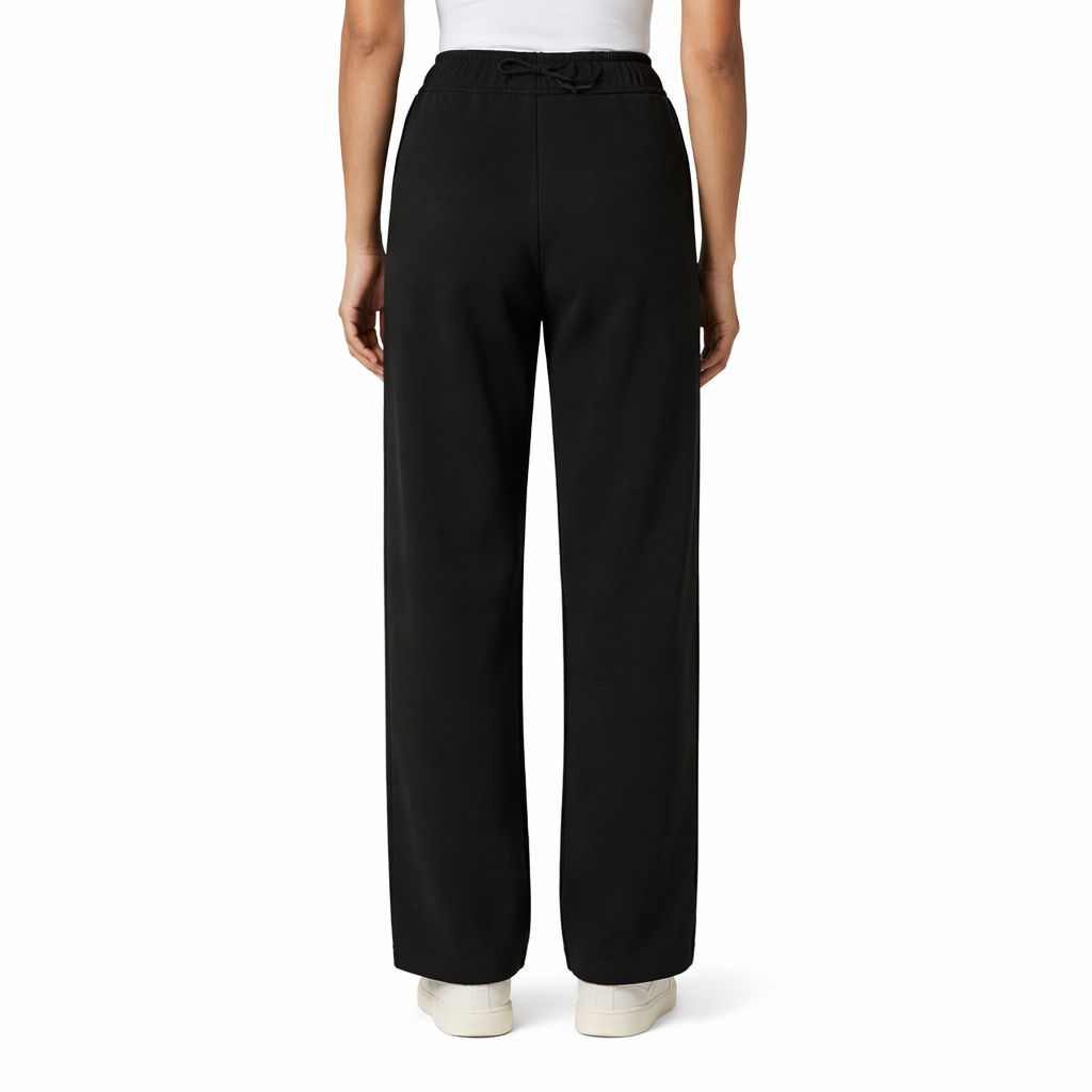 Black pants worn by a person on a white background