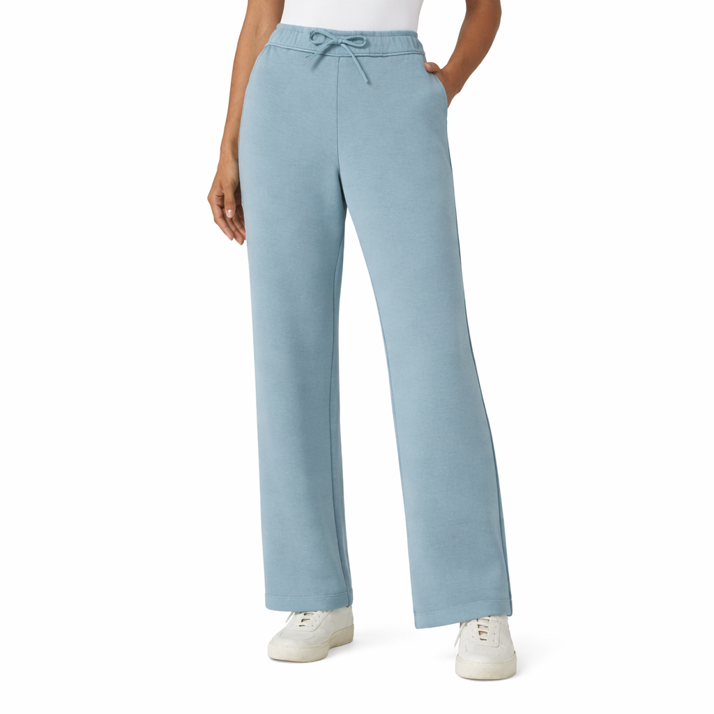Teal pants worn by a person on a white background
