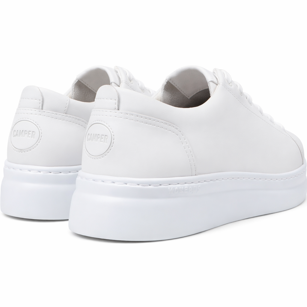 White sneakers with a brand logo on a white background