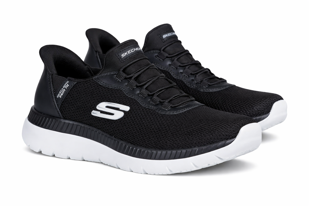 Black sneakers with white soles on a white background