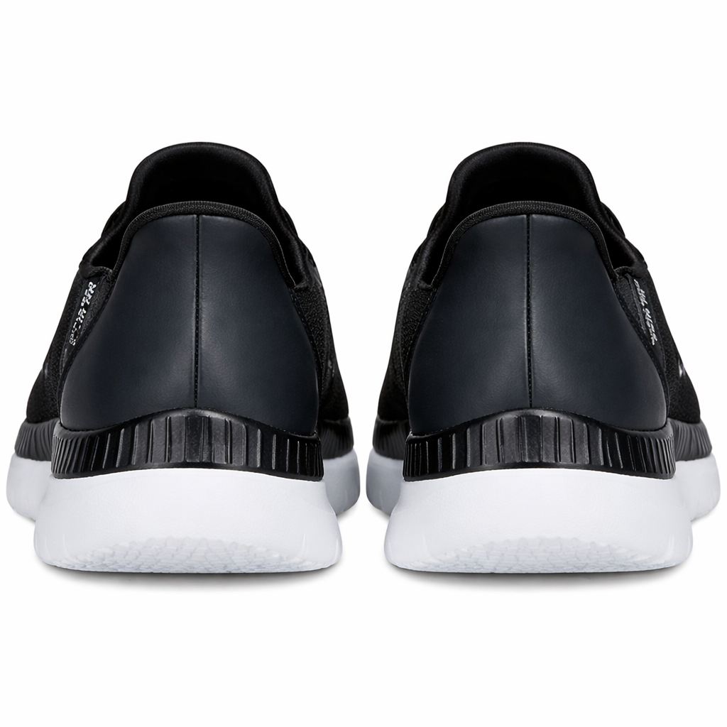 Black slip-on shoes with white soles on a white background