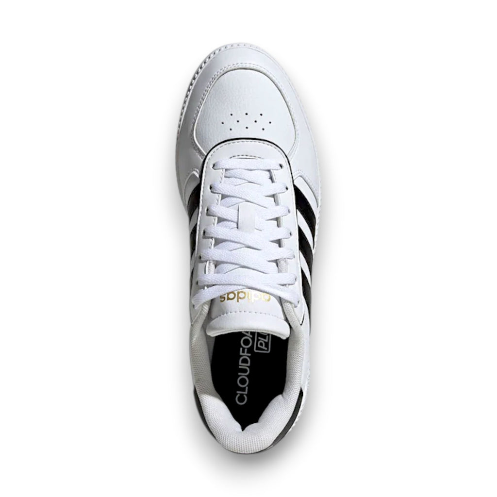 White sneaker with teal accents on a white background