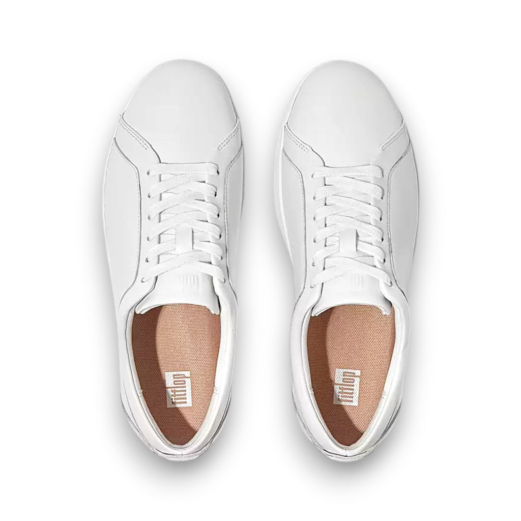 White sneakers with brown soles on a white background