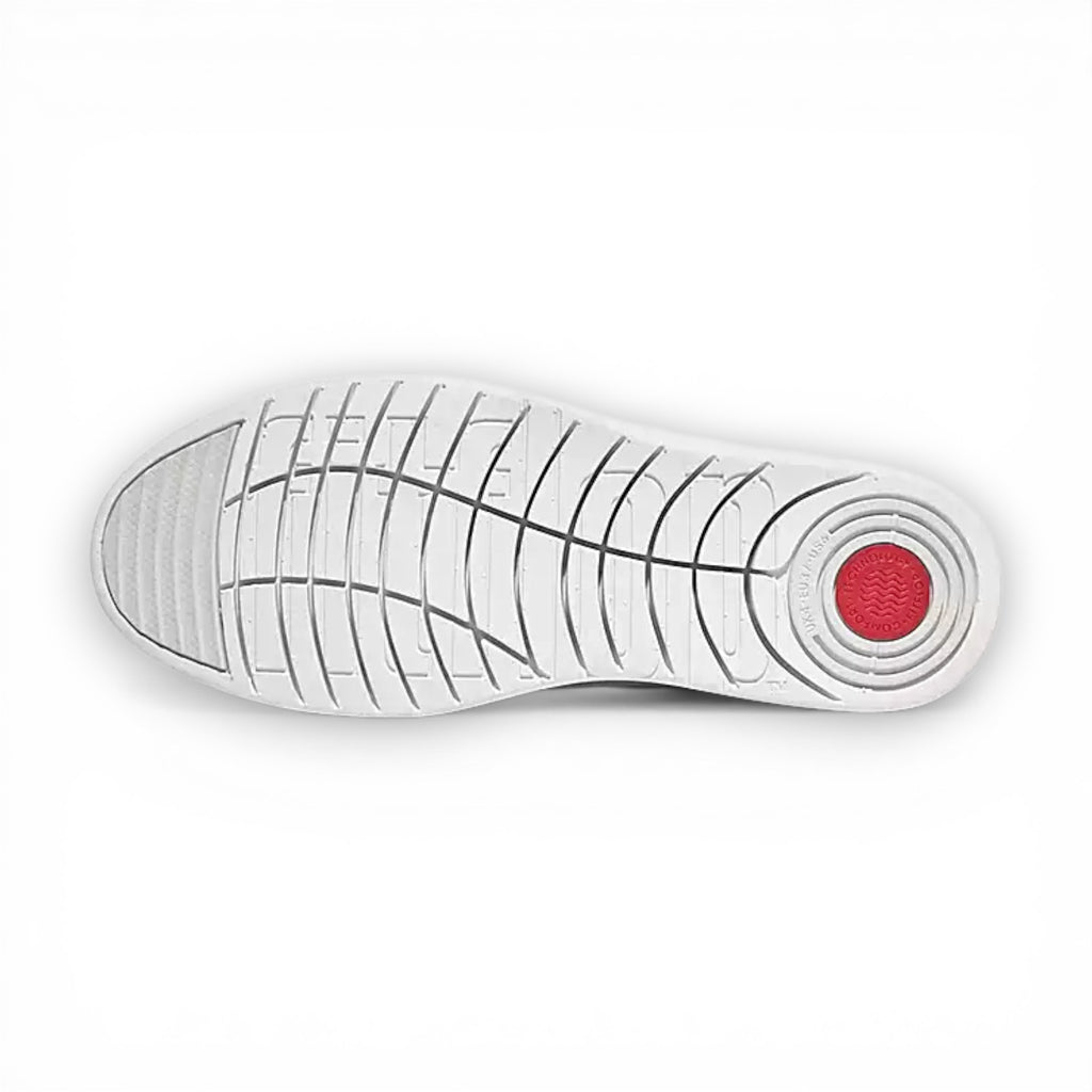 White shoe sole with red circular detail on a white background
