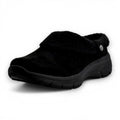 Black slip-on shoe on a white background