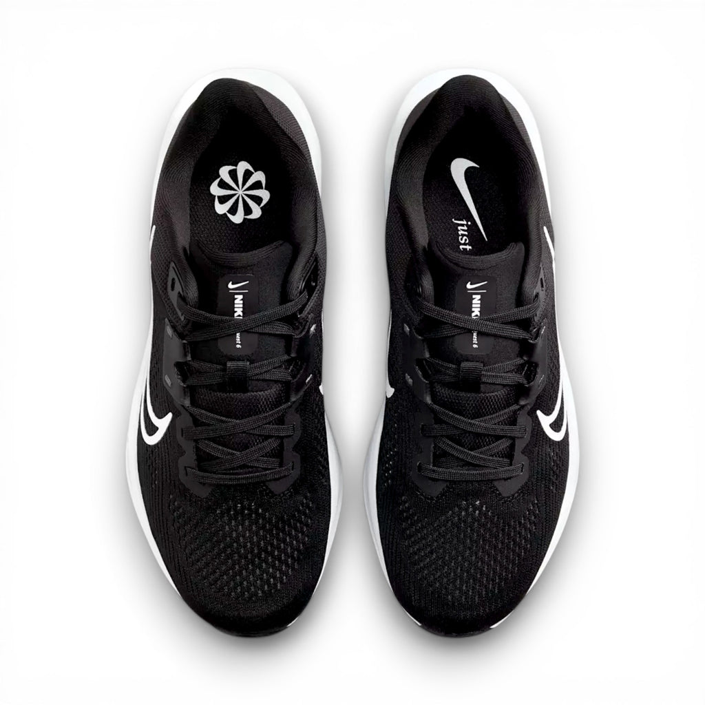 Black running shoes with white swoosh logo on a white background