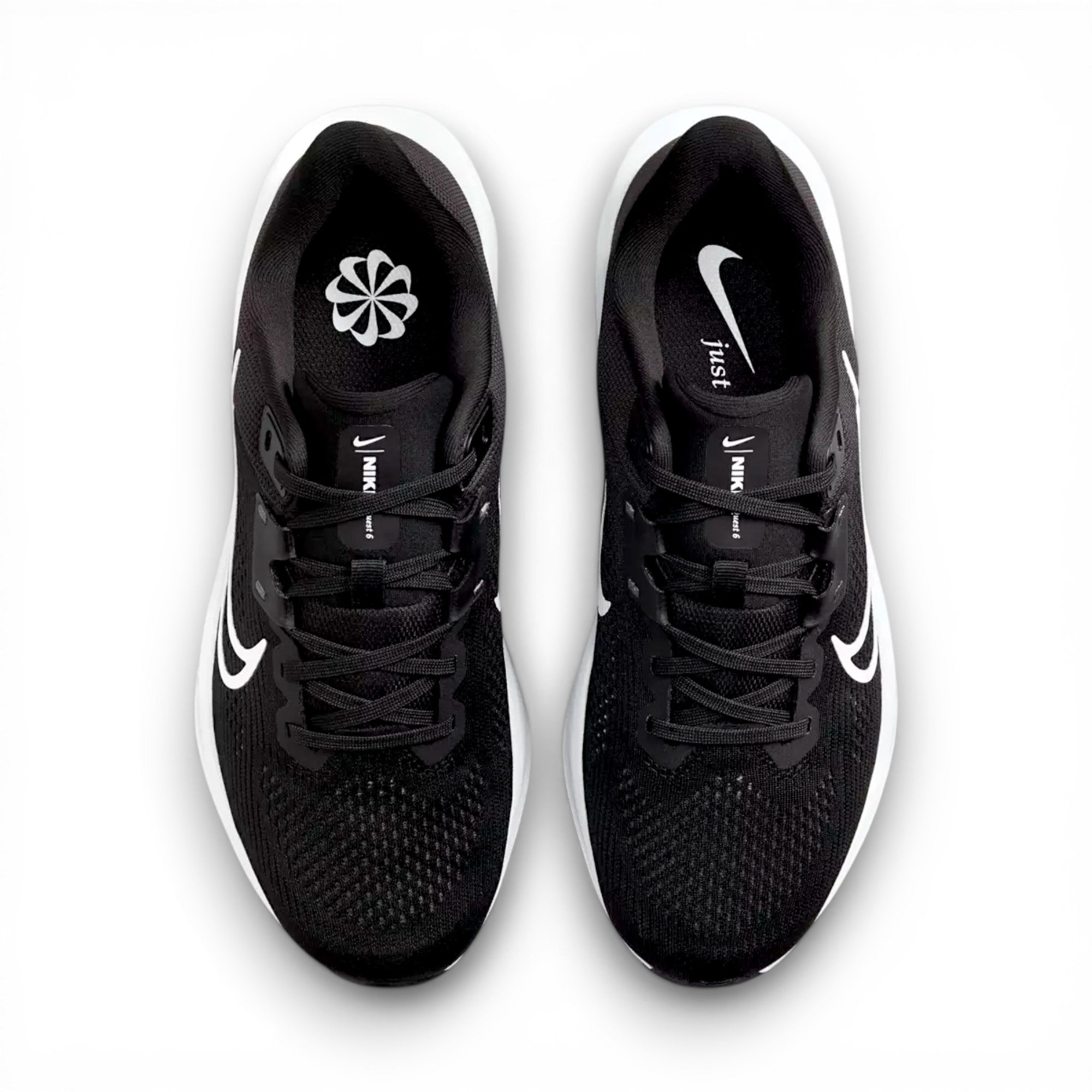 Black running shoes with white swoosh logo on a white background