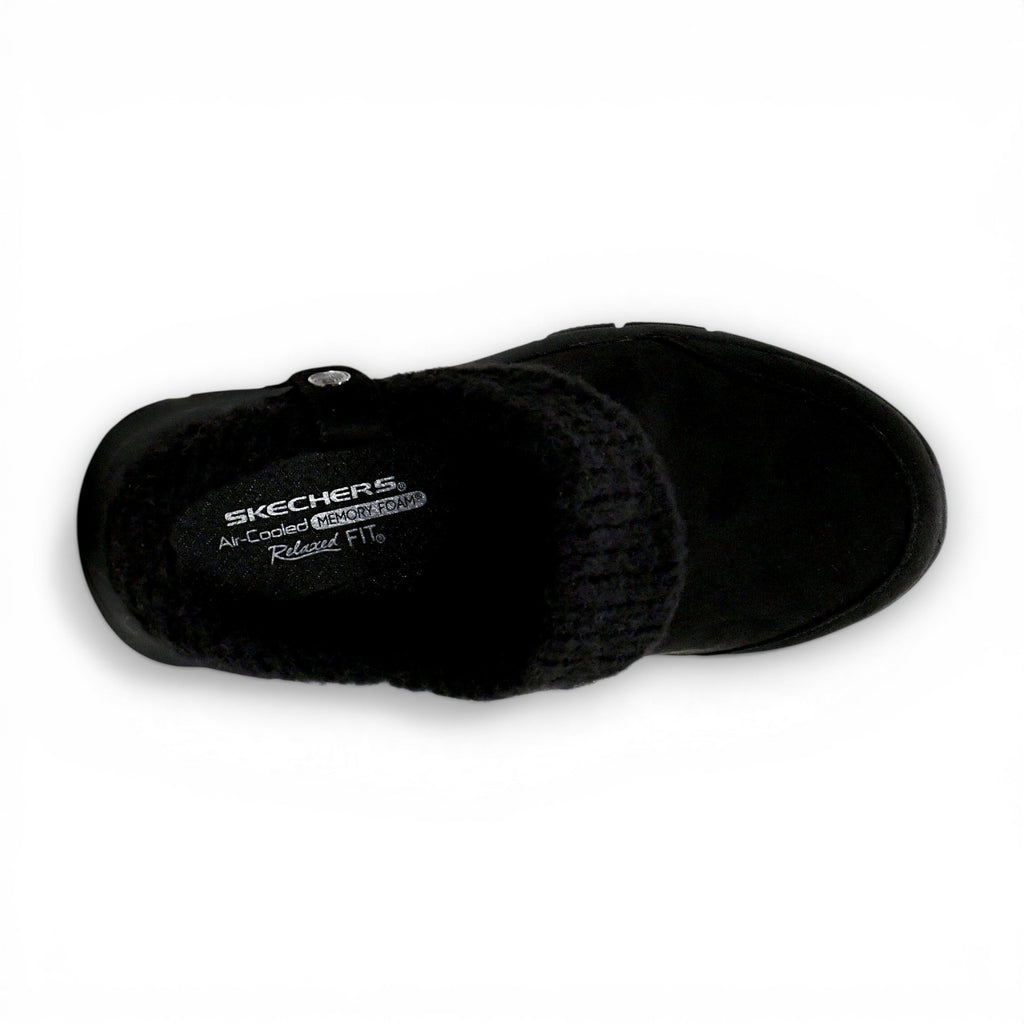 Black slip-on shoe with 'Skechers' branding on a white background