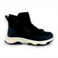 Black high-top sneakers with white soles on a white background