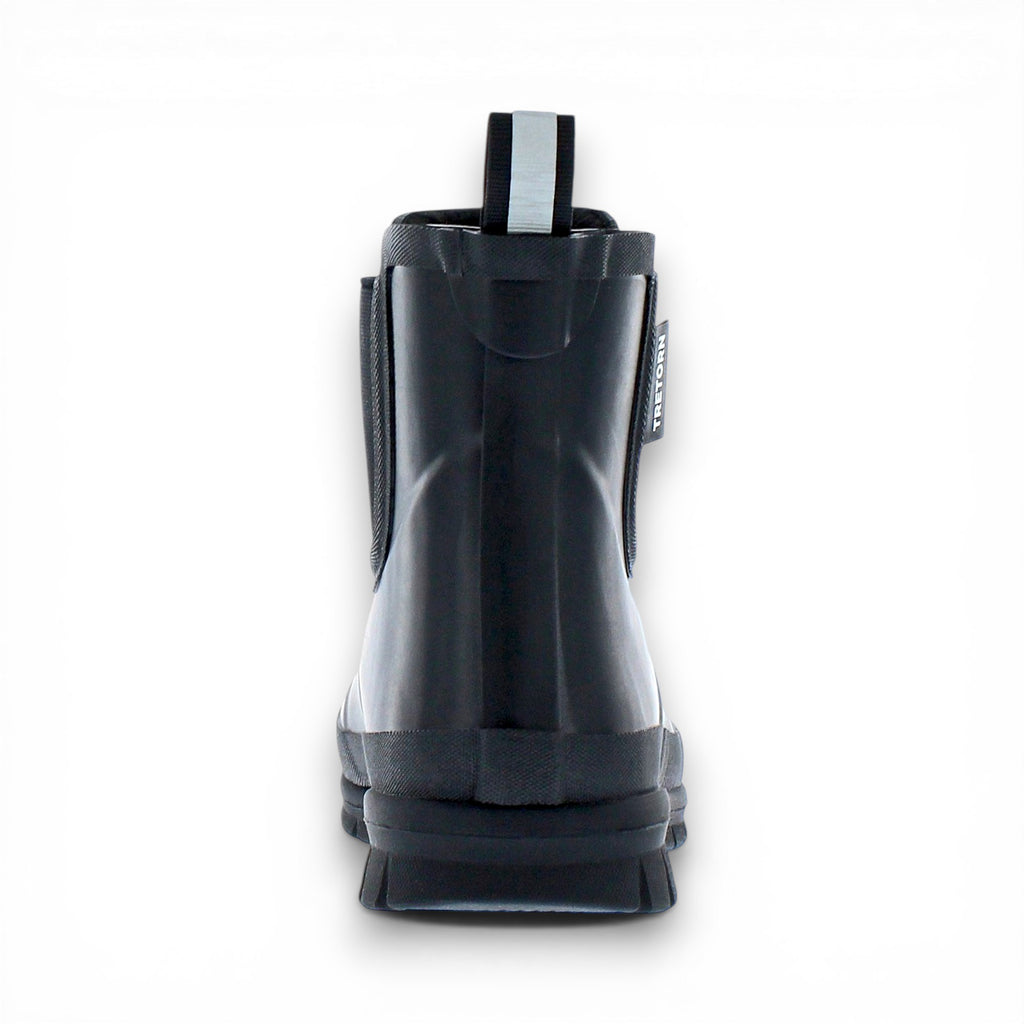Black rain boot with a visible brand label on a white background